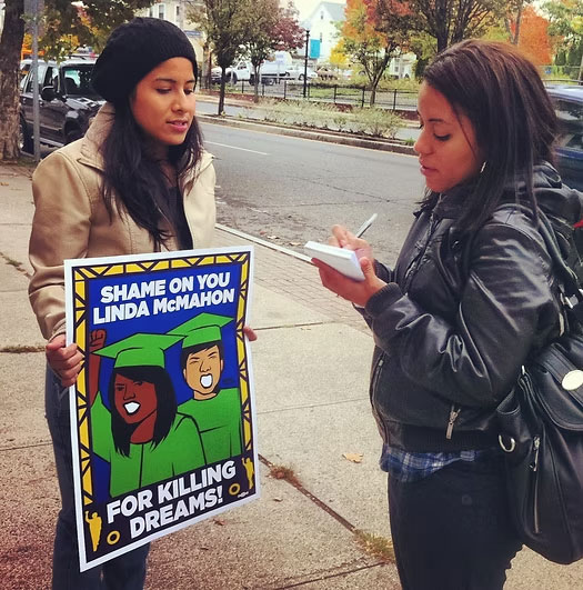 ct-immigrant-student-holding-sign